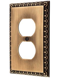 an antique style light switch plate with decorative designs on the front and back plates in bronze