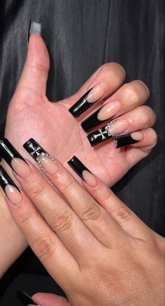 White Square French Tip Nails With Design, Black Acrylic Nails With Jewels, Black Acrylics With Gems, Acrylic Nails With Crosses, Black Gem Acrylic Nails, Black French Tip With Cross, Black Long French Tip Nails, Black French Tip Rhinestone Nails, White Nails With Cross Design