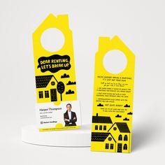 a yellow door hanger with an image of a house on it