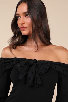 You'll be the center of attention in any room when you're wearing the Lulus Major Charisma Black Off-the-Shoulder Bow Long Sleeve Top! Stretchy ponte knit shapes this flattering top that has long sleeves and an off-the-shoulder neckline with a mesh-style overlay that has tonal velvet polka dots and forms a bow at the front. Fitted bodice continues down to a lightly cropped hem. Fit: This garment fits true to size. Length: Size medium measures 15" from top to bottom. Bust: Great for any cup size. Fitted Black Off-shoulder Top, Black Fitted Off-shoulder Top, Fitted Off-shoulder Top For Fall Party, Fitted Black Cold Shoulder Top, Fitted Off-shoulder Top For Party, Fitted Boat Neck Evening Tops, Fitted Boat Neck Top For Evening, Black Off-shoulder Top For Fall Party, Cold Shoulder Off-shoulder Top For Evening