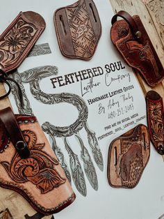 several leather items are laid out on a table with the name feathered soul written in it