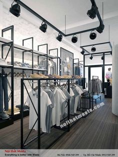 a clothing store with clothes and shoes on racks