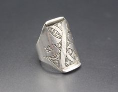 I am offering You Moroccan Tuareg silver traditional berber ring. Its 100% hand crafted workmanship with beautiful engraved design. Please do not hesitate to contact if you have any questions about items or further informations, Measures :  Size of the ring 6.5 on US Jewelry Ring mandrel, Length of the ring : Inches 1" ( 2.5 cm ) Width : Inches 0.4" ( 1.5 cm ) Weight : 5.2 Grams, Traditional Stamped 925 Engraved Ring For Ceremonial Occasions, Traditional Sterling Silver Engraved Ring For Ceremonial Occasions, Traditional Engraved Ceremonial Ring Stamped 925, Traditional Sterling Silver Engraved Ring, Traditional Silver Engraved Ring, Traditional Silver Stamped Rings, Traditional Silver Rings With Carved Details, Traditional Handmade Silver Engraved Ring, Traditional Silver Carved Rings