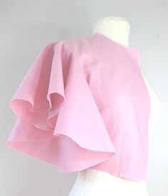 a mannequin wearing a pink top with ruffles