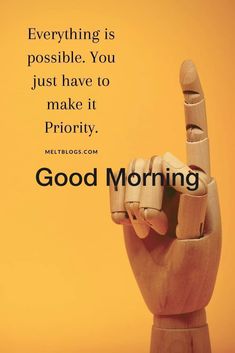 a wooden hand making the peace sign with a quote about good morning on yellow background