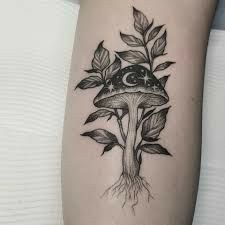 a black and white photo of a mushroom tattoo