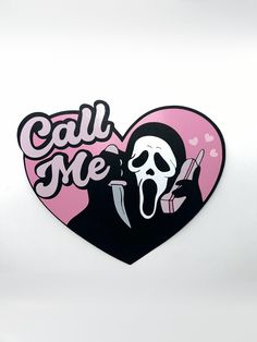 a heart shaped sticker with a skeleton holding a knife in it's mouth