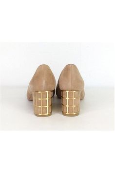 One-of-a-kind pumps in a tan suede. They feature a unique caged heel in a gold-tone metal. Pointed toe style adds a sleek touch. Size 7 M Leather upper Synthetic lining/sock Man made outsole Pointed toe No outsole wear Caged heel Heel height 2.5" Modern Gold Low Heels, Modern Gold Low Heel Heels, Modern Gold Low Heel Shoes, Chic Gold Heels With Metal Feet, Gold High Heel Court Shoes With Reinforced Heel, Gold Open Toe Suede Heels, Gold Suede Open Toe Heels, Spring Gold Heels, Gold Court Shoes With Sculpted Heel