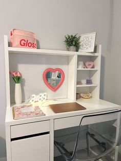 a white desk with a chair and shelves