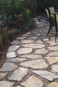 an outdoor patio area with chairs and tables