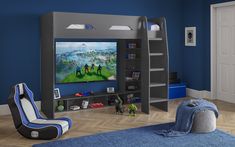 a child's bedroom with blue walls and furniture, including a large television set