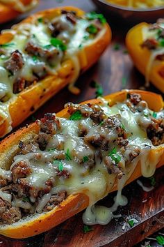 stuffed peppers with cheese and meat on a cutting board