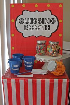 there is a candy bar set up with cups and bowls on the table next to it