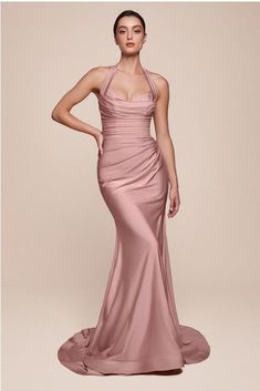 Experience the ultimate in sophistication and elegance with our Luxury Stretch Satin Halter Gown. Made with the finest quality materials, this gown hugs your curves and features a flattering halter neckline. Perfect for your next special occasion, be the envy of all in this exclusive and timeless piece. Dry Clean Only Brand Size Dress Bust Waist Hip XS 0-2 31-32.5'' 23-24'' 31-34" S 4--6 33-35'' 25-26'' 35-37" M 8--10 35-36'' 27-28'' 38-39" L 12--14 38-40'' 29-31'' 40-42" XL 14-16 40-42'' 33.5-36'' 44-46" 2XL 18-20 42-44'' 37-40'' 47-50" 3XL 22-24 44-46'' 41-46'' 51-55" 4XL 26-28 46-48'' 47-50'' 56-60" Mauve Gown, Satin Halter Dress, Stretch Satin Dress, Long Halter Dress, Cinderella Divine, Satin Evening Dresses, Halter Gown, 21st Dresses, Floor Length Gown