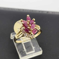 Look at this stunning 14k gold ring with  genuine rubies and diamonds. This ring is perfect for any occasion gift box included. Let us know your size  Hermoso anillo todo en oro 14k con rubies genuinas y diamantes. Este anillo esta perfecto para toda ocasion. Incluimos una cajita de regalo. Dejenos saber su medida Red Cluster Diamond Ring In 14k Gold, Red Diamond Cluster Ring In 14k Gold, Yellow Gold Cluster Ruby Promise Ring, Cluster Ruby Rings With Diamond Accents, Yellow Gold Ruby Cluster Ring For Promise, Ruby Cluster Rings With Diamond Accents, Red 14k Gold Rings With Diamond Accents, Fine Jewelry Red Diamond Ring Stamped 14k, Fine Jewelry Cluster Ruby Promise Ring