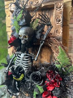 a skeleton decoration with flowers on it