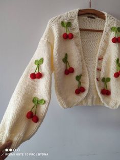 a knitted sweater with cherries on it