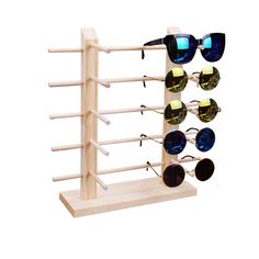 a wooden display rack with sunglasses on it