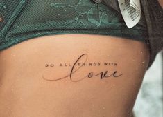 a woman's stomach with the words do all things with love written on it