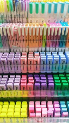 several rows of different colored pens on display in front of each other with the same color