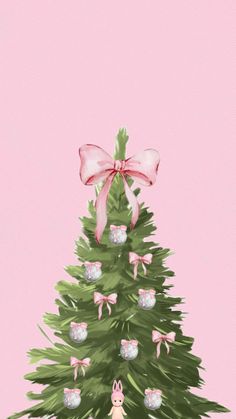 a christmas tree with pink bows on it