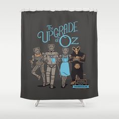 the upgrade of oz shower curtain with three people dressed as wizard and cat, standing in front