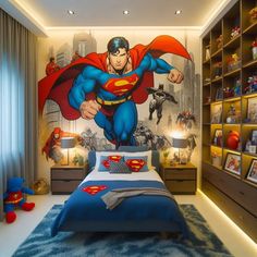 a bedroom with superman mural on the wall and blue bedding in front of it