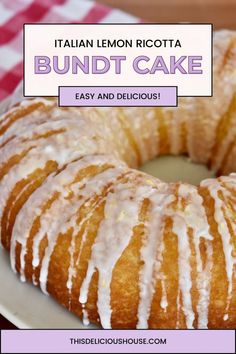 a lemon ricotta bundt cake on a white plate with pink gingham tablecloth