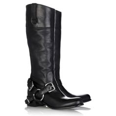 a pair of black boots with buckles on the side and heeled soles