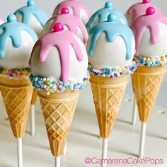 there are ice cream cones with sprinkles on the top and in the middle