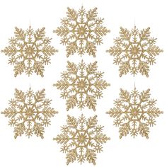 six gold snowflakes hanging from strings