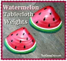 two watermelon shaped plates sitting on top of a wooden floor