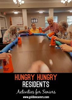 several elderly people sitting around a table with orange cups on it and the caption hungry hungry residents activities for seniors