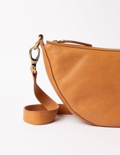 Say hello to Leo, the slouchy leather bag that fits all that you need for a busy day in town. Think of Leo as the cool sibling of our more structured Laura bag. Leo can be worn across the body as a bum bag, or on the shoulder as chic arm candy. Leo is unisex, catering to everyone who embraces that bumbag style. Leo comes in our wild oak soft grain leather, that timeless addition to any outfit. Do you want to wear Leo as a longer cross-body bag? Make sure to also add this strap to your cart. OMB-E174Q Versatile Cognac Shoulder Bag With Smooth Grain, Versatile Hobo Bag With Smooth Grain For Everyday Use, Cognac Smooth Grain Versatile Shoulder Bag, Versatile Smooth Grain Hobo Bag For Everyday Use, Versatile Hobo Bag For Everyday Use With Smooth Grain, Versatile Cognac Hobo Bag, Versatile Cognac Bag With Smooth Grain, Versatile Soft Leather Saddle Bag For Daily Use, Versatile Cognac Hobo Bag For Everyday Use