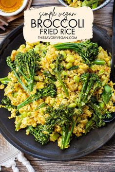 broccoli fried rice on a black plate next to two bowls of vegetables and a glass of beer