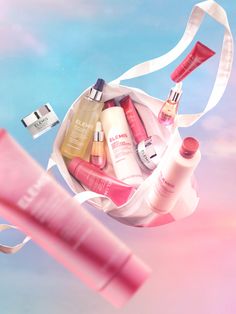 a white bag filled with lots of different types of beauty products in it's pouch