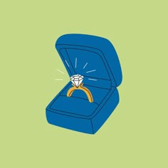 an open blue box with a diamond ring in it's center and green background