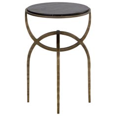 a round table with metal legs and a black marble top on an isolated white background