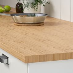 a bowl sitting on top of a wooden counter