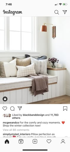 an instagram page with pillows and blankets on the window sill in front of a window