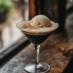 an ice cream sundae sitting on top of a wooden table