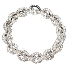 The bracelet is a chain model, and is made up of twenty-seven round links on which 30.76 ct of white diamonds are set. The bracelet is in 18 Kt white gold. The closure of the bracelet is perfectly invisible, to be able to distinguish it, the diamonds on the closure are white. • The bracelet is in 18 Kt gold • Total diamond size: ct 30.76 • Weight of the bracelet: 61.00 grams • Length of the bracelet: 19.5 cm •Single Piece • It is possible to combine the bracelet with white diamonds with a bracelet with black diamonds. In this case the two bracelets can also be worn together as a necklace. •THE MANUFACTURE IS MADE IN ITALY •THE JEWEL IS IN 18 KT GOLD •EACH ITEM IS SOLD WITH THE BAGLIONI JEWELERY GUARANTEE CERTIFICATE, WHICH CERTIFIES THE CHARACTERISTICS AND AUTHENTICITY OF THE STONES AND MA Modern Bracelets, Diamonds And Gold, Diamond Sizes, White Diamonds, Luxury Jewelry, Beautiful Bracelet, Black Diamond, White Diamond, Diamond White