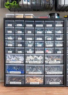 a shelf filled with lots of different types of screws and nails in bins