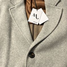 100% Cashmere, Made In Italy, Oozes Quality. Italian Outerwear Size 52, Fits Xxl. New With Tags / Sold Out Online. Purchased Online From Nomanwalksalone. Wish This Fit Me, Photos Do Not Do Justice To How Soft This Thing Is. I Bought Final Sale Thinking This Was Equal To Us Suit Size 42, But It Is Bigger - 24” Pit To Pit. 45” Total Length. Luxury Winter Outerwear With Hidden Button Closure, Designer Long Coat For Fall, Luxury Long Sport Coat For Fall, Elegant Winter Outerwear For Everyday, Elegant Everyday Winter Outerwear, Designer Winter Outerwear With Concealed Placket, Designer Winter Sport Coat With Lapel Collar, Designer Notch Lapel Sport Coat For Winter, Luxury Single Breasted Gray Outerwear