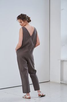 "MsWrinkle's clothing - from human to human. 100% handmade. *Description* - Free fit linen cross back jumpsuit with pockets on front. - High quality European linen; - Washed and softened (doesn't shrink anymore); - Medium weight linen (150 g/m2); - Our linen is OEKO-TEX certified that meets human ecological safety requirements; - Model is wearing size S in greyish brown and honey yellow (other sizes and colours please choose on the right); - Not transparent; - Not ironed and we suggest to use tu Sleeveless Overalls With Side Pockets In Relaxed Fit, Linen Jumpsuits And Rompers With Pockets For Work, Sleeveless Linen Overalls With Pockets, Sleeveless Linen Overalls, Casual Sleeveless Linen Jumpsuits And Rompers, Casual Sleeveless Linen Jumpsuit, Relaxed Fit Linen Overalls With Pockets, Linen Overall Jumpsuit With Pockets, Linen Overall Jumpsuits And Rompers With Pockets