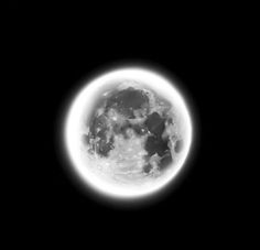 an image of the moon taken from space in black and white, with some light on it