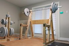 the gym equipment is ready to be used in this home exercise area, as well as other things