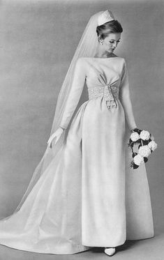 an old photo of a woman in a wedding dress