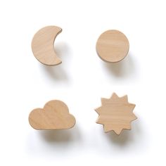 three wooden magnets shaped like the moon and stars, one in the shape of a cloud