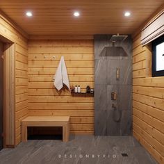 a bathroom with wooden walls and flooring, including a shower stall that has a bench on the side